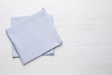 Clean napkins on wooden background