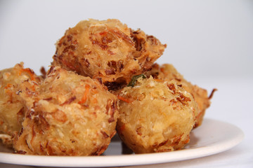 Traditional Indonesian Vegetable Fritters Snack called “Bakwan” or “Gorengan”