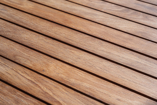Texture of caramel color of wooden planks of slats