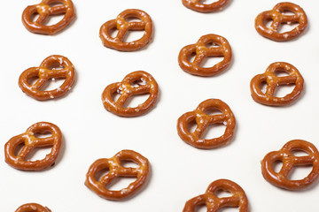 Pretzel with salt pattern on white background