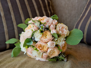 Bridal bouquet of roses and peonies.