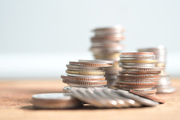 Business Concept, Finance Growth in investment for saving up money with coin stacked in pile on wooden background with copyspace