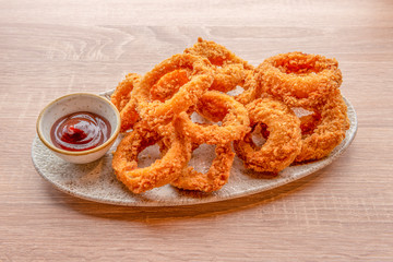 onion rings plate on wooden table