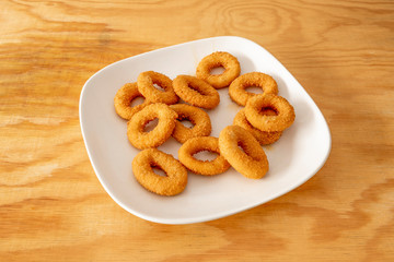 onion rings plate on wooden table