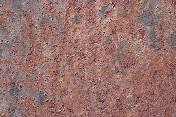 Oxidized metal surface, rust on iron surface, abstract rusty metal panel texture background.