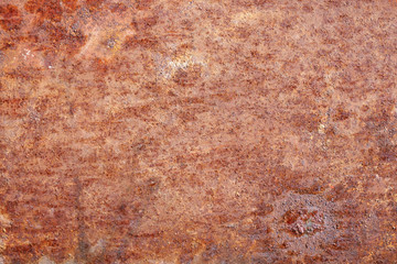 Oxidized metal surface, rust on iron surface, abstract rusty metal panel texture background.
