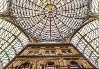 The dome of Galleria Umberto I. Galleria Umberto I is a public shopping gallery in Naples, a high and spacious cross-shaped structure, surmounted by a glass dome.