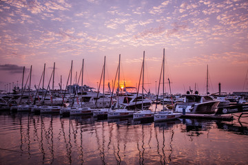 Yachts in the port at sunset