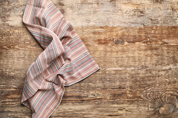 Clean napkin on wooden background