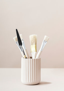 Paintbrushes and art tools in a cup