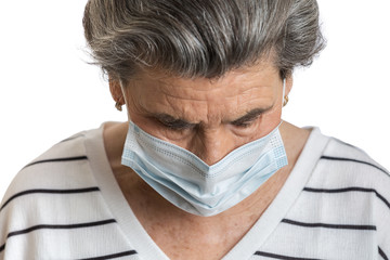 Unhappy elderly female in medical mask