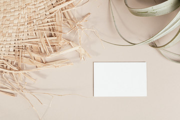 Blank business card decorated with woven and dried grass