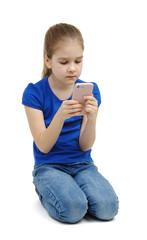 little girl looking at mobile phone