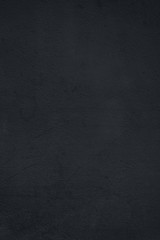 surface of the stucco wall in a dark blue tone.