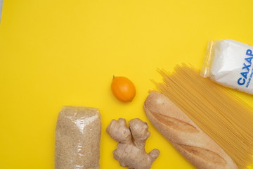 Grocery set in the days of isolation on a yellow background.