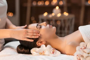 Gordijnen Beautiful young woman receiving massage in spa salon © Pixel-Shot