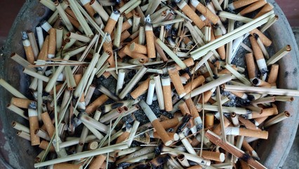Cigarette butts discarded in the dump