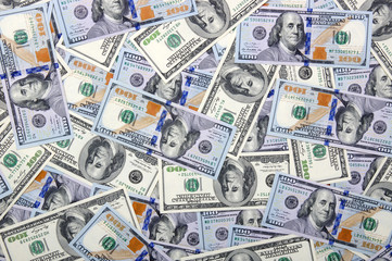  Heap of one hundred dollar bills on money