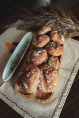Fresh homemade breads with some decorations on the table.