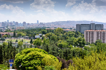 Fototapeta premium Ankara, Turkey - July 24, 2018: View above of Ankara houses with tiled roofs and skyscrapers