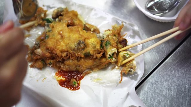 Chopsticks sharing crispy Chinese oyster fried pancake 1