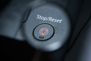 Stop/Reset button  under magnifying glass.  