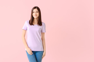 Woman in stylish t-shirt on color background