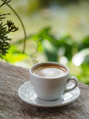 Hot coffee americano on the old wooden table