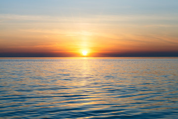 scenic ocean landscape, golden sunset or sunrise at sea