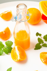 orange juice in a glass bottle close-up
