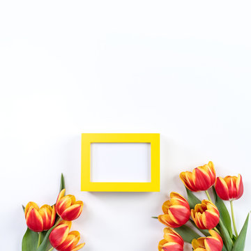 Mother's Day Design Concept, Tulip flower bunch - Beautiful Red, yellow bouquet isolated on white background table, top view, flat lay, copy space