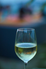
glass of white wine at sunset