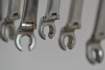 Shiny spanners in a row in the working place of a mechanic.	
