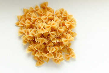 Heap Of Farfalle Pasta, On White background