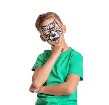 Funny little boy with face painting on white background