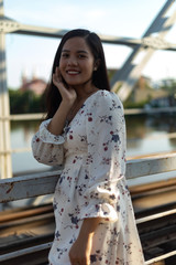 Vietnamese girl standing on an old bridge