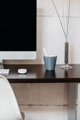 A desktop computer monitor sitting on top of a table