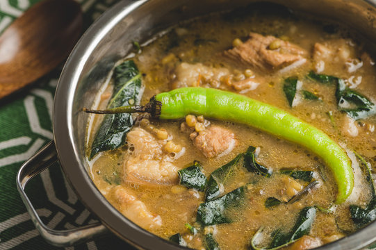 Sauteed Mung Beans (Ginisang Monggo) is a Filipino dish that typically contains mung beans, tomato, onion garlic, chili leaves and pork.