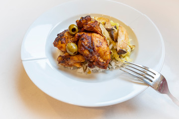 Moroccan Chicken Served on Bed of Rice Accompanied with Cabbage and King Oyster Mushroom