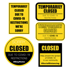Temporarily closed yellow signs for coronavirus pandemic situation
