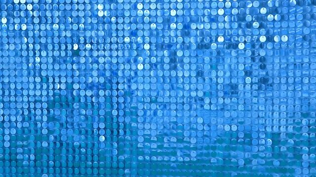 Background from sparkly sparkles sparkling in the wind. Sparkling glitter background, sequins texture bokeh with iridescent luster