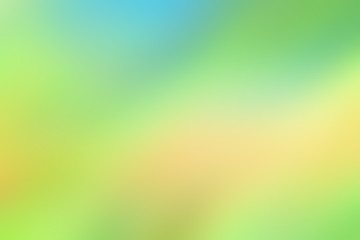 Soft, blurred background. Bright vibrant colors of yellow, green and blue.