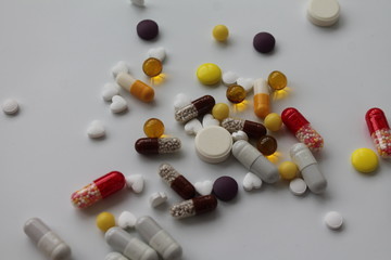 A pile of pills is scattered on the table. Elevated temperature. Epidemic / disease. 