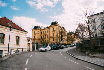 Fototapeta premium Austria, Melk, 8 march 2020 old yellow house during sunny day