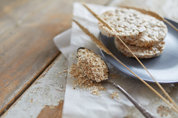 Cereal bread on vintage wooden table. Top side view with copy space. Selective focus