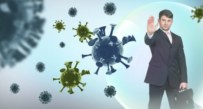 Young businessman shows stop sign among coronavirus cells.