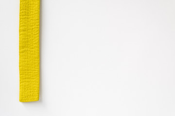 Zen art. Yellow belt martial arts on white background. Substrate for diplomas, posters, sites on...