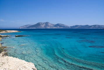 The beautiful Greek island of Koufonissi.  Crystal clear calm waters with a view to the uninhabited...