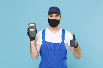Delivery man in cap t-shirt uniform mask gloves isolated on blue background studio. Guy employee...