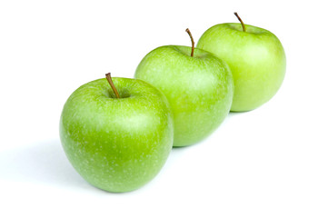 Three ripe green apples on a white background. isolated